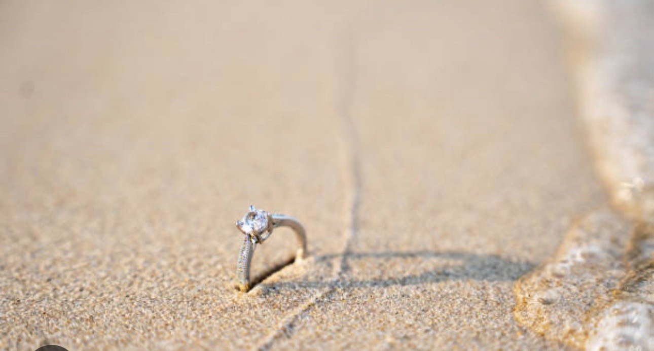Engagement ring found in sand near the shoreline